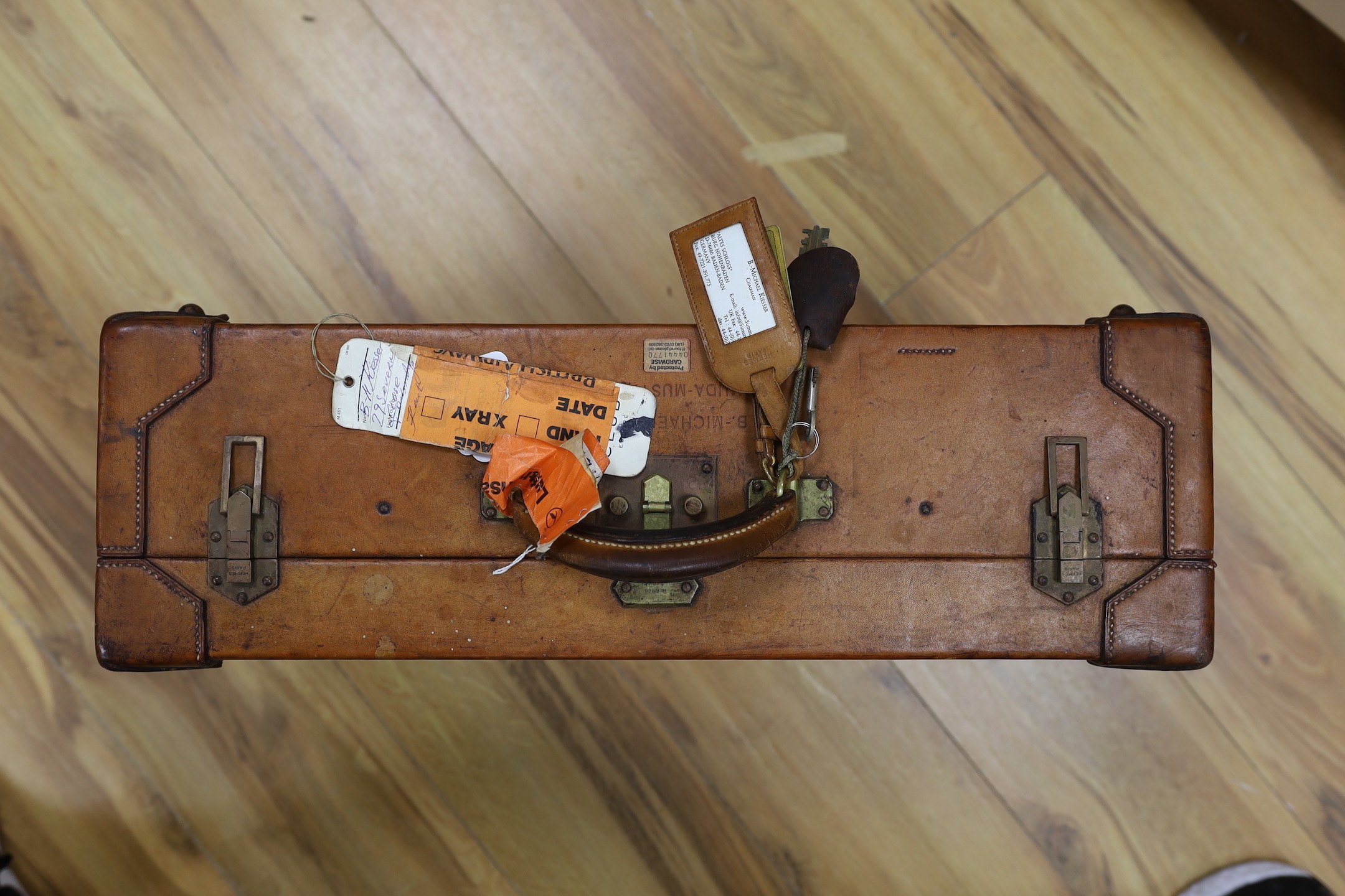 A brown leather suitcase